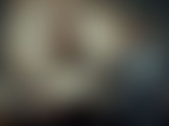 Two men in suits in a distressed office; one looks distressed with papers, the other smiles with a badge. A damaged wall shows a falling graph.