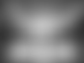 A high-angle wide shot of Stamford Bridge just before kick-off on Saturday, March 14, 2026. The Chelsea team, in their traditional blue home kit, and the Newcastle United team, wearing their "Tyne Bridge" inspired dark green away kit with white detailing, are lined up facing the East Stand. The stadium floodlights are on for the 5:30 PM GMT kick-off, casting a sharp glow over the pristine pitch. In the background, the "Matthew Harding" stand is a sea of blue and white, while the away corner is packed with Newcastle fans in