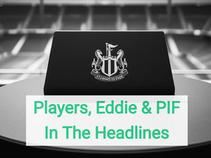A wide, high-detail shot of the empty Newcastle United press conference room at St. James' Park. The iconic black-and-white branded backdrop is illuminated by overhead studio lights, with the long desk and microphones sitting ready for a briefing. In the foreground, several blurred laptop screens and notebooks suggest a media presence just out of frame. The cold, professional lighting of the room captures the tension of a club currently dominating the back pages.