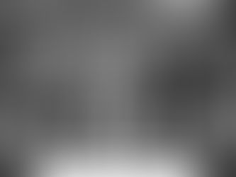 A poignant medium shot at the final whistle in North London. The focus is on a weary Bruno Guimarães shaking hands with Arsenal’s goalscorer, Eberechi Eze. In the background, the Arsenal squad celebrates returning to the top of the table, while the traveling Newcastle fans are visible in the upper tier, some still applauding the effort despite the result. The stadium's digital boards show the final score "ARS 1 - 0 NEW" under the glowing floodlights, capturing a moment of mutual respect amidst Newcastle’s deepening season of struggle.