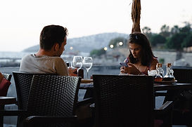 Couple dining by the seaside.