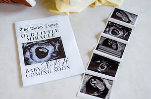 Mesa, Arizona lifestyle photography pregnancy announcement detail shot with 'Our Little Miracle' newspaper announcement and sonogram strip.