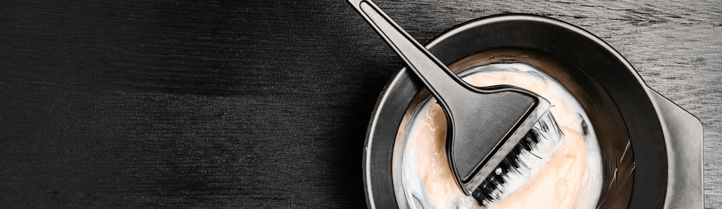 Tools for hair dyeing on the black wooden background. Colouring of hair at home.jpg