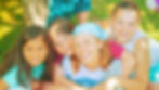 Summer staffer is hugged by summer campers
