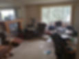Cluttered living room needing various types of cleaning.