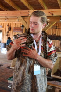 A person with a snake