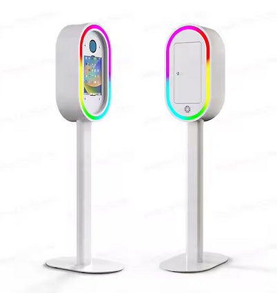 Luxury white photo booth with colorful LED ring lighting and tablet display, premium event photography equipment by BOMBA Creative Co Orlando