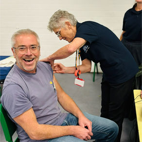A volunteer getting his flu vaccination