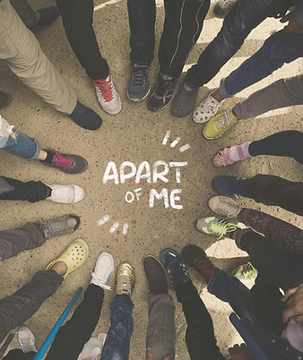 Feet of young people standing in a circle around the chalk-drawn Apart of Me logo on the ground, symbolizing community and connection.