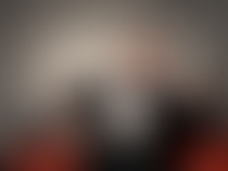 man in tuxedo smoking and having champagne