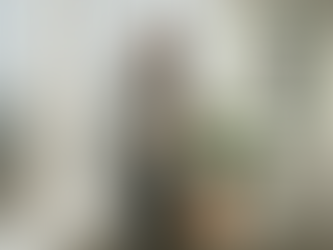 Professional examines sustainable shirt in office