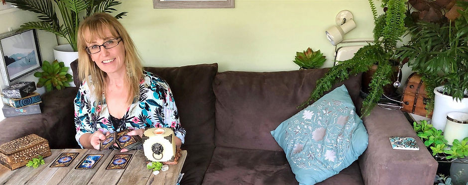 Book a tarot reading with Simone. Pictured with The Gilded Tarot.