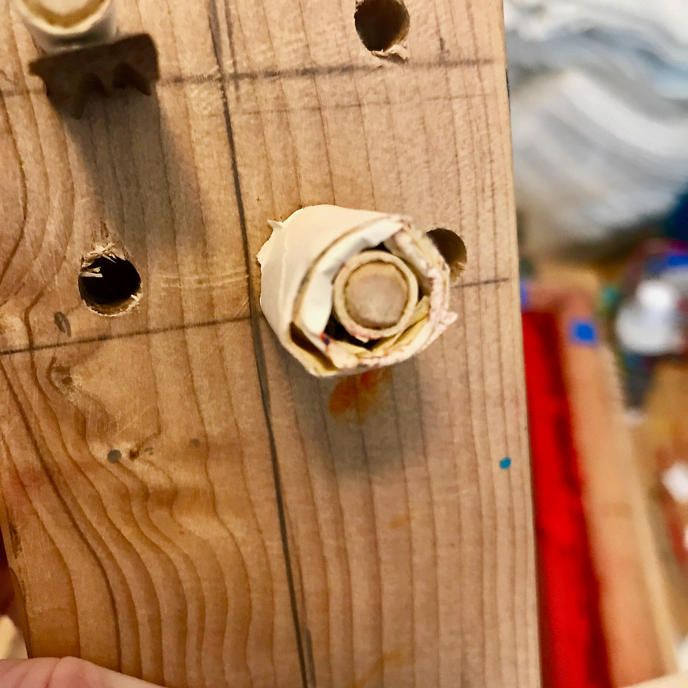 dowel wrapped in tape is part of a squeegee holder for screenprinting dishtowels.