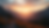 Eye-level view of a serene mountain landscape with a sunrise