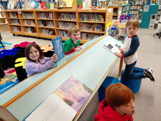 Students on new stools in library