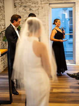 wedding celebrant wearing black at a ceremony at howards vineyard
