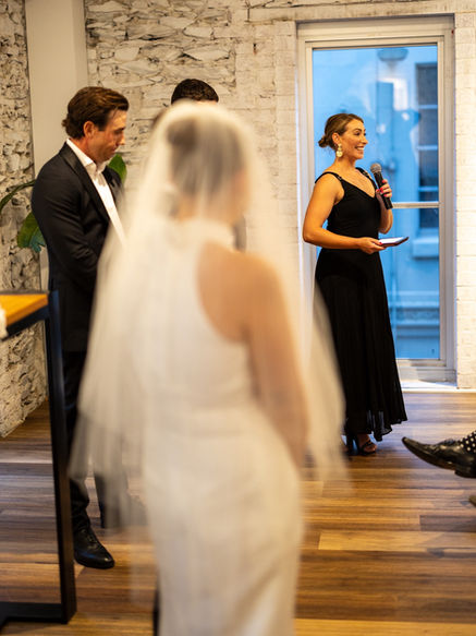 wedding celebrant wearing black at a ceremony at howards vineyard