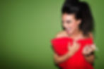 Fashion Model laughing with red cushion