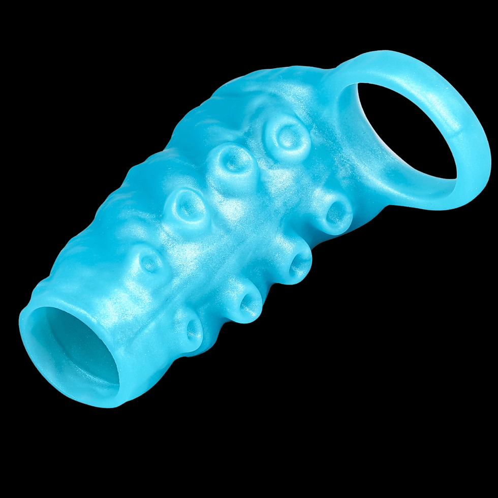 Blue textured silicone sleeve with ridges and holes on a black background
