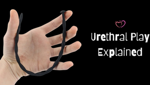 Hand holding a black urethral toy on a black background. Text reads "Urethral Play Explained" with a heart symbol.