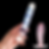 Hand holding clear glass dildo with blue spots beside a red-and-blue striped toy on a black background.