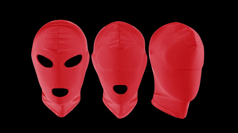 Three red full-face masks on a black background, with the middle mask lacking eye holes. The scene is minimalist and striking.