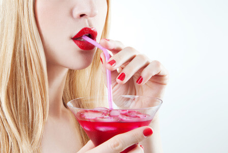Lady Drinking Red Cocktail