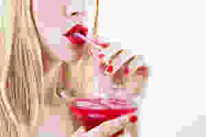 Lady Drinking Red Cocktail
