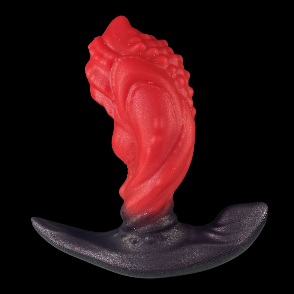 Abstract red flame-like fantasy anal plug rising from a dark curved base against a black background.