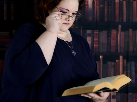 Author HR Burkett reading a book.