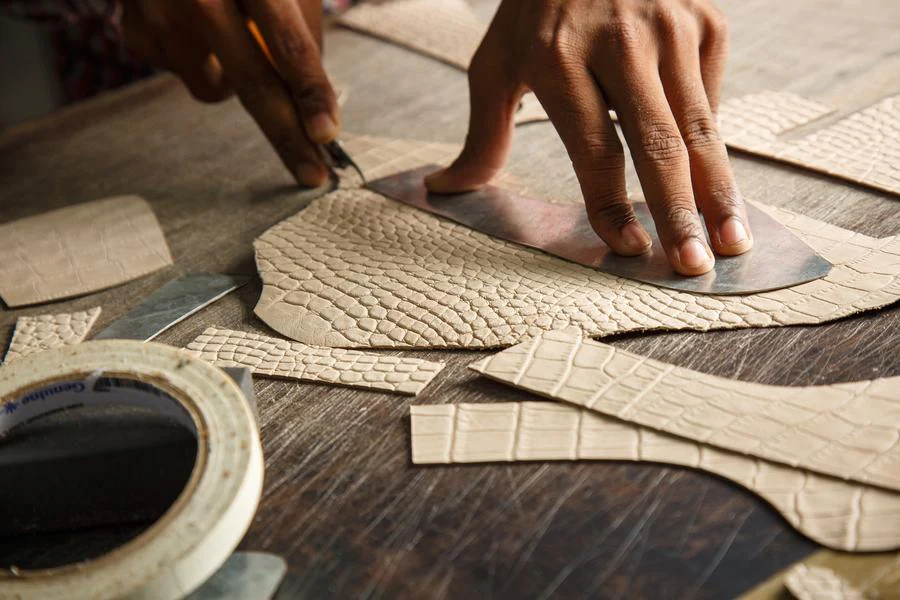cutting leather for shoes.webp