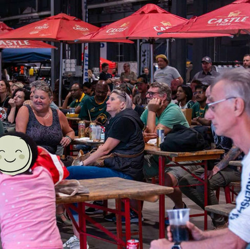 group of people sitting at a sports bar