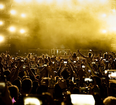 rear-view-excited-fans-having-fun-music-festival-taking-pictures-stage-with-their-smart-ph