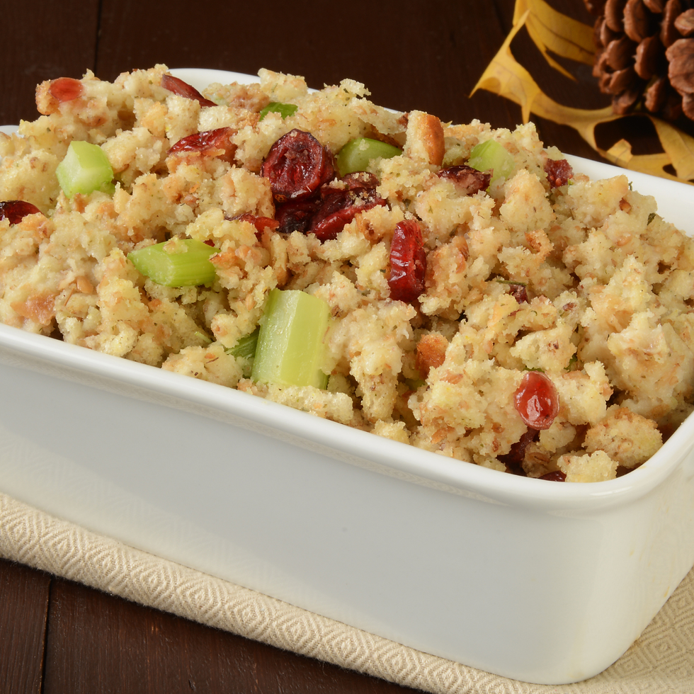 Homemade vegan holiday stuffing made with sourdough bread, mushrooms, onions, and fresh herbs, baked until golden and crisp.
