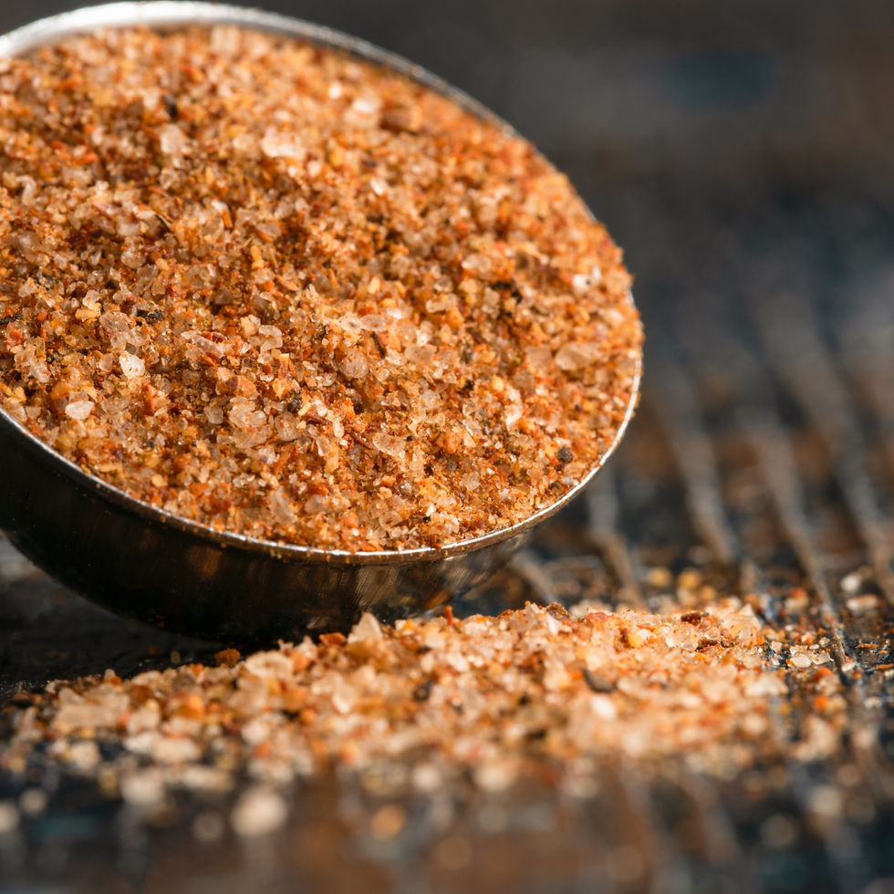 Small bowl of homemade taco seasoning made with chili powder, cumin, smoked paprika, garlic powder, and pantry spices