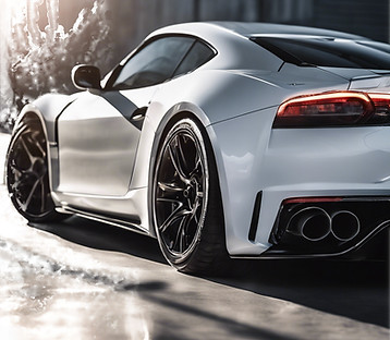 light shining on the side of a sports car making the side of the image completely white.jp