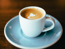 cup of coffee with crema in tiny espresso cup