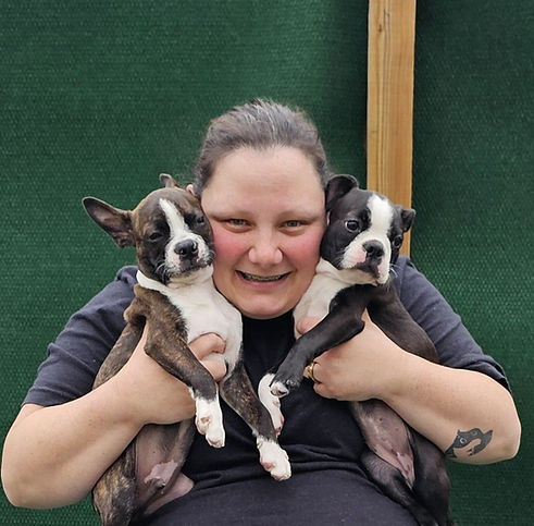Picture of Meghan Hale holding two dogs