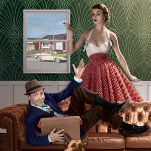 A man, woman, and dog relaxing in their living room.