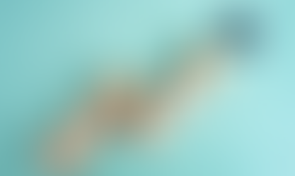 Wooden blocks with ascending arrows lead towards a colorful target with an arrow in the bullseye, symbolizing progress and goal achievement.