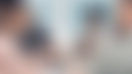     A diverse group of professionals engaged in a lively discussion during a collaborative office meeting, showcasing positive teamwork and effective communication.