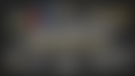 Business plan diagram on chalkboard with graphs, captions like "Success," "Goal," and icons symbolizing strategy, management, and timeline.