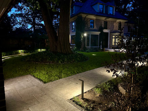 home at night with landscape lighting
