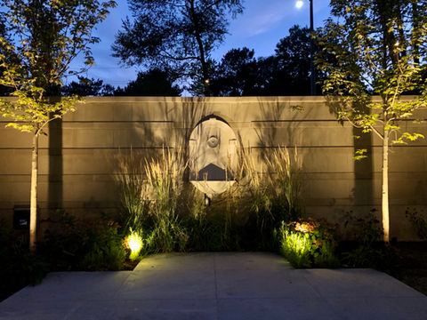 home at night with landscape lighting
