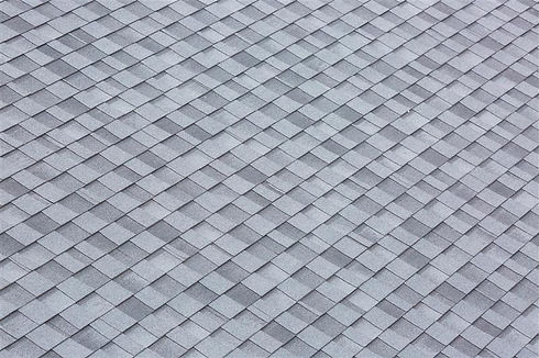 Installation of roof asphalt shingles. Bitumen roof shingles texture