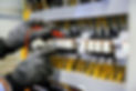 Electrical engineer using digital multi-meter measuring equipment to checking electric current voltage at circuit breaker in main power distribution board