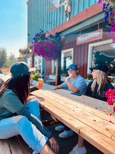 Girls having ice cream on the deck
