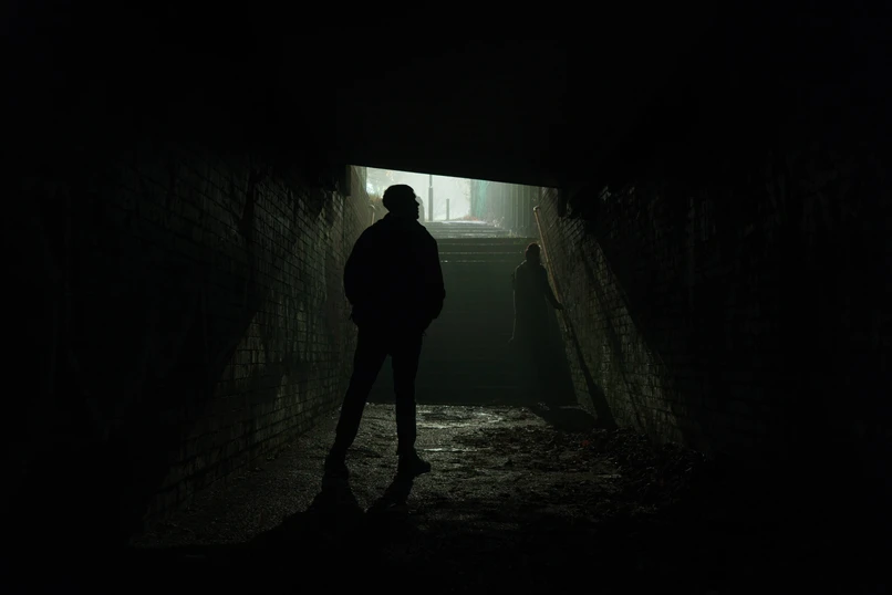 A cinematic photo of a couple in a tunnel for a photography tutorial