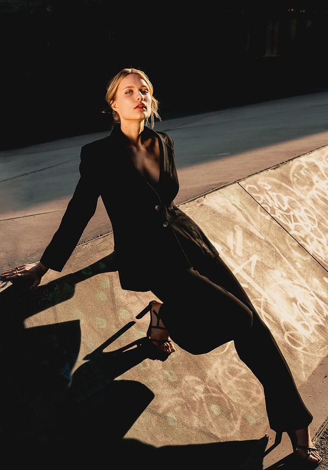 Young woman in black outfit on a concrete ramp. the best location for Street fashion photography