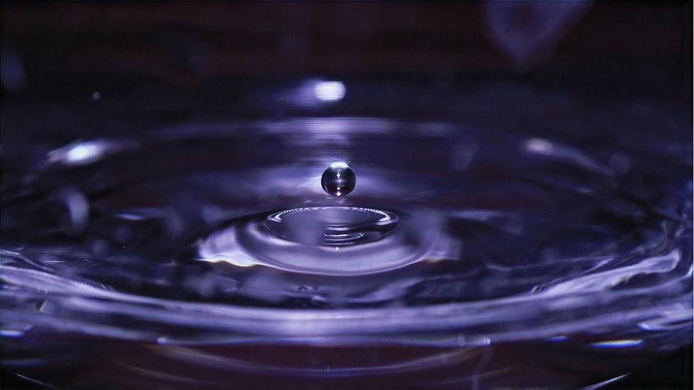 a single droplet of water creating a ripple connecting waves to neurodivergent rhythms
